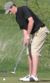 Me golfing during a high school golf match