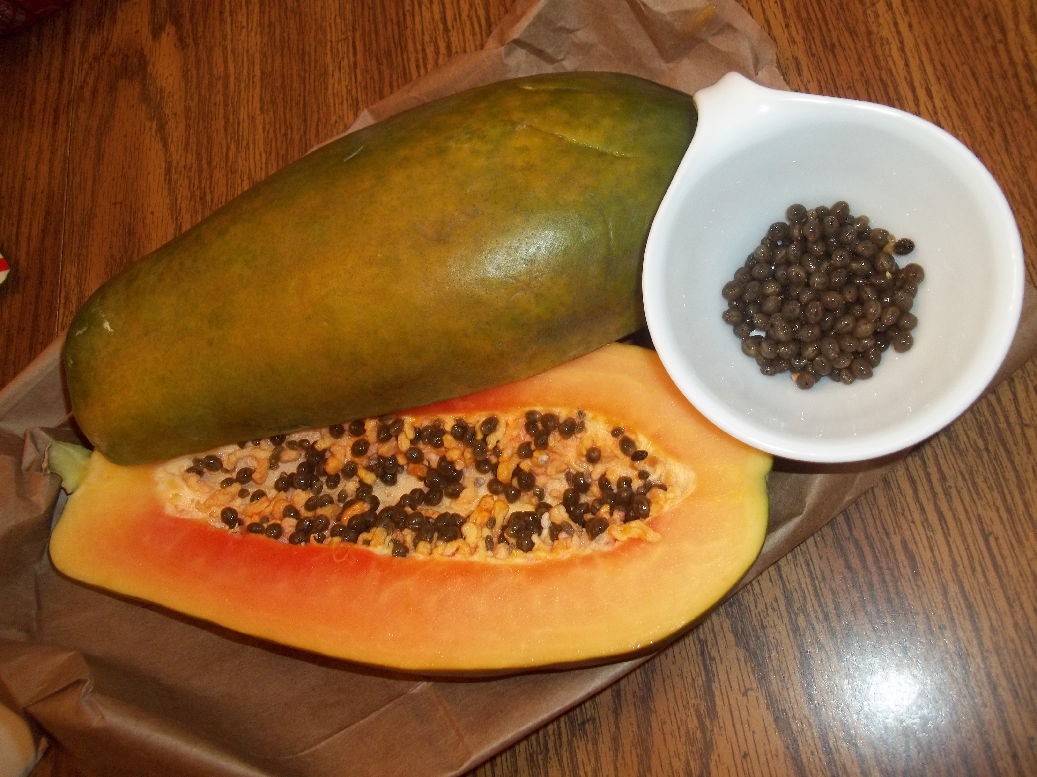 carica papaya and its seeds in a tea cup.  Picture taken by me! 