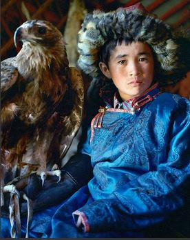 Young Mongolian boy with Golden Eagle. Permission by John Delany Photographer. http://johndelaney.net/Portfolio.cfm?nL=0&nS=0&nK=4961&i=58185#0