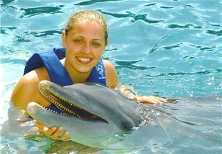 This is a picture of myself in Mexico with a bottlenose dolphin.