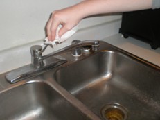 Remember to turn off faucet with a paper towel. (Picture of my hands, taken by friend)