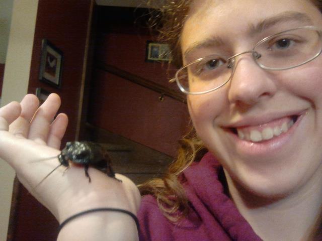 A picture of myself with Ivan, the Madagascar Hissing Cockroach. Picture taken by Sarah Szczerbinski.