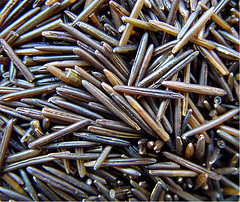 Image shows a close-up of wild rice grains.